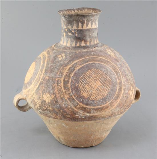 A Chinese pottery two handled jar, Neolithic, c.2600-2300BC, height 31cm, restored